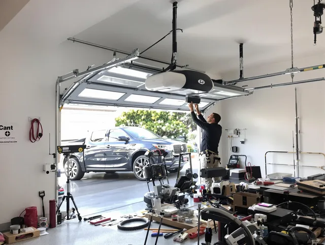 Davidson Garage Door Repair specialist installing smart garage door opener system in Davidson home