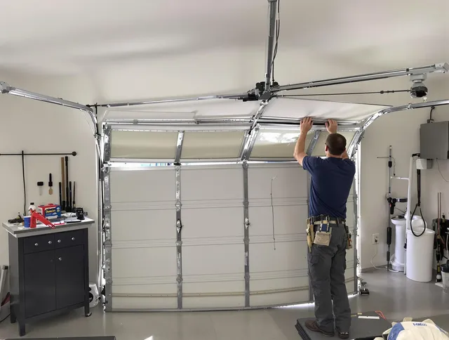 Davidson Garage Door Repair specialist performing precise section replacement on Davidson garage door
