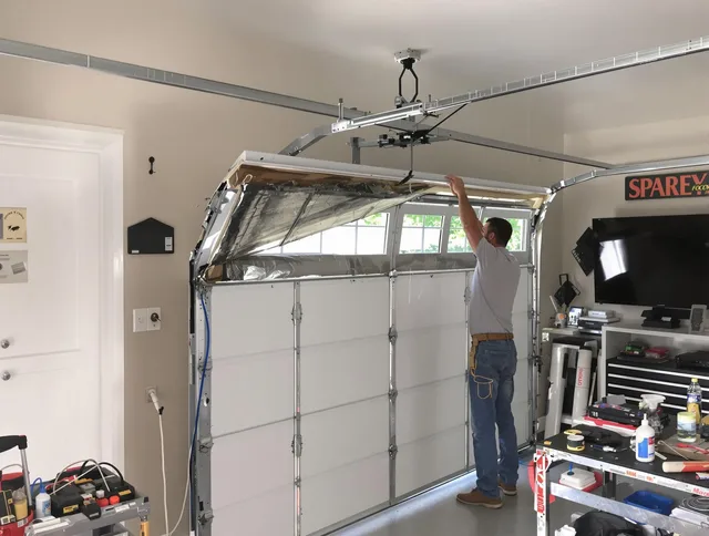 Garage door section replacement by Davidson Garage Door Repair in Davidson